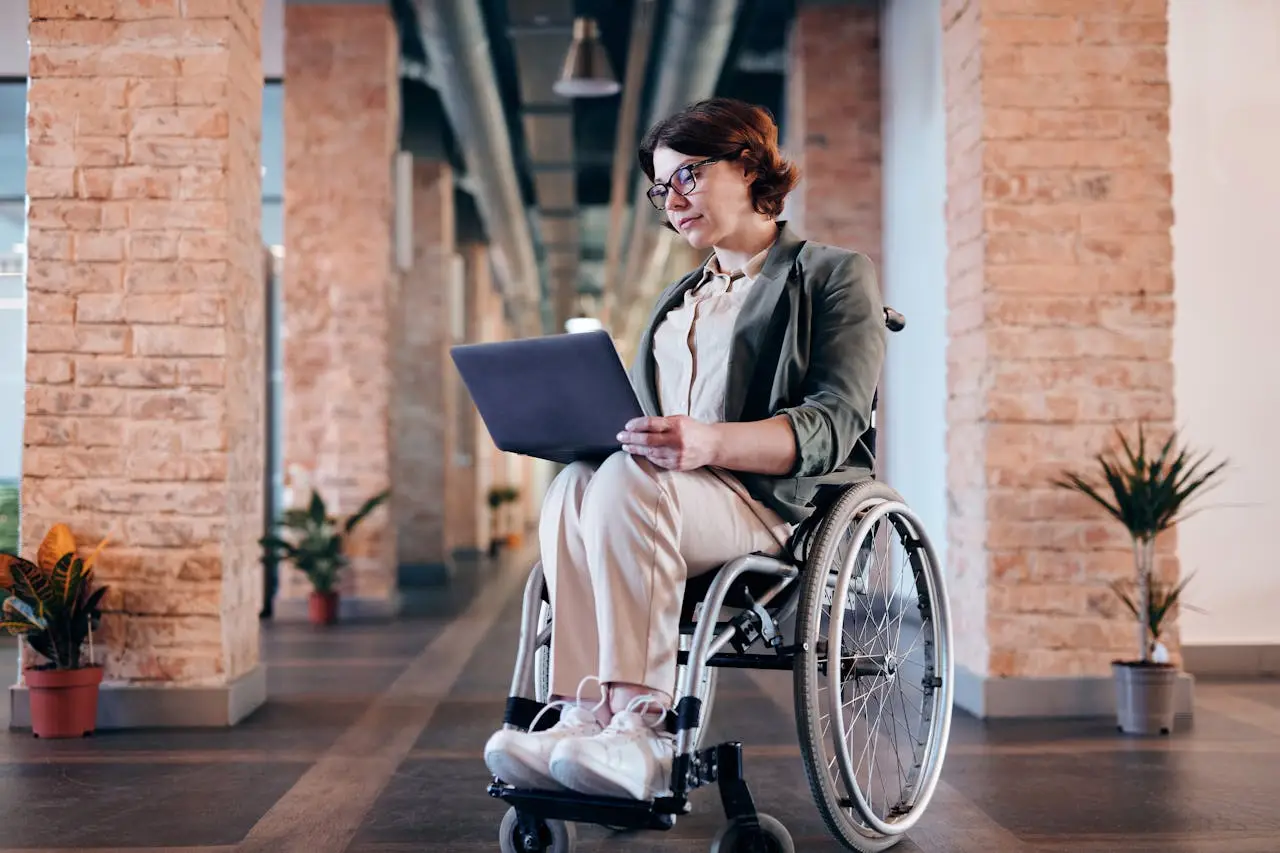 blue badge medical letter- lady in blue top on a wheelchair ordering the letter from doctument