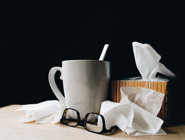 self certitification sick note - showing a picture of cup of coffee with glasses, to demostrate a sick working professional